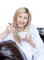 Delighted woman having a breakfast
