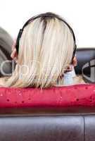 Concentrated woman using headphones