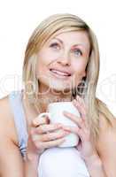 Bright woman holding a cup of coffee