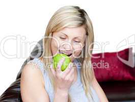 Bright woman eating an apple