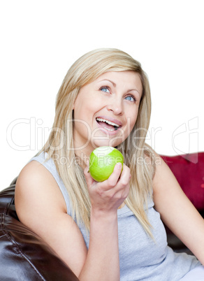 Smiling woman eating an apple