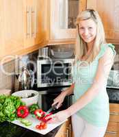 Beautiful woman preparing a salad
