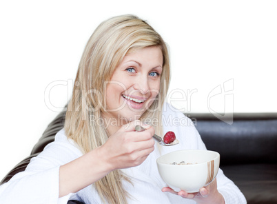 Cheerful woman having a breakfast