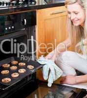 Beautiful housewife preparing cookies
