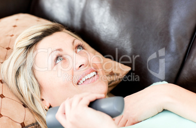 Lively woman using a remote