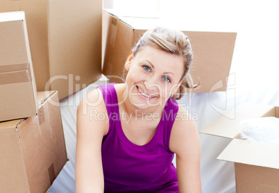 Beautiful woman unpacking box