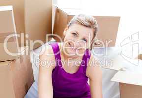 Beautiful woman unpacking box
