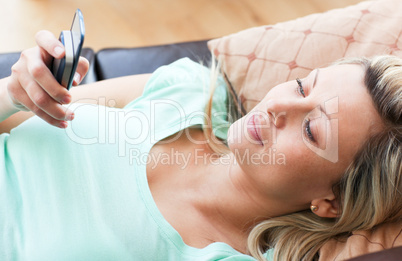 Cheerful woman using a phone