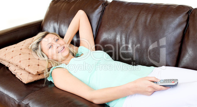 Caucasian woman using a remote