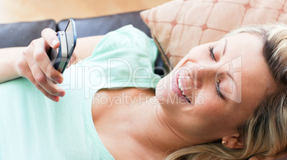 Smiling woman using a phone