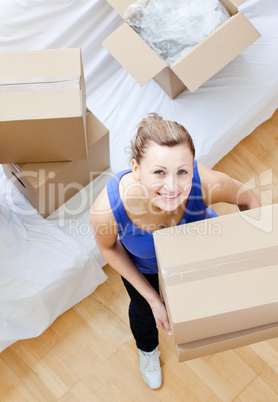 Radiant woman holding a box