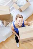 Radiant woman holding a box