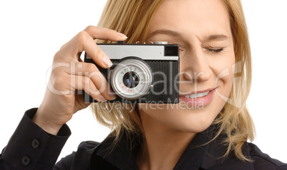 young woman taking a shot with photo camera