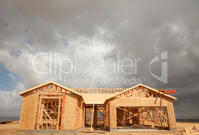 Abstract Home Construction Site and Ominous Clouds
