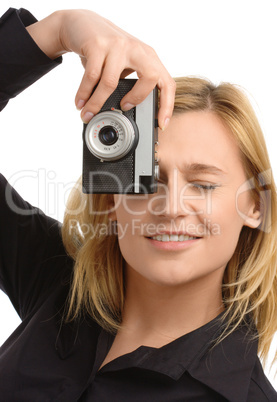 young woman taking a shot with photo camera