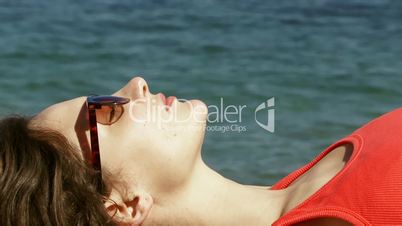 Woman in glasses on the beach