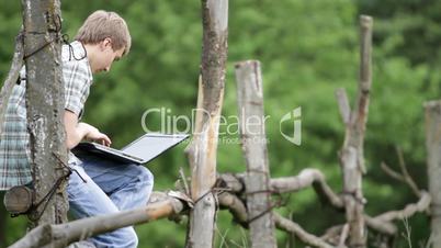 teenager with a laptop.