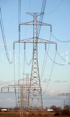 Electric pylons in field