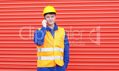 Handsome male engineer talking on the phone