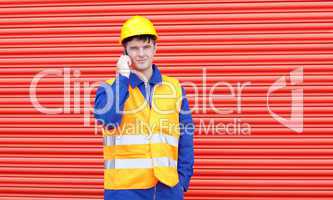 Handsome male engineer talking on the phone