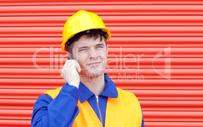 Happy male engineer talking on the phone