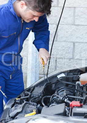 Attractive man repairing a car
