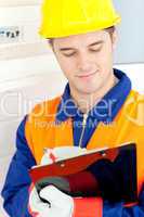 Confident electrician repairing a power plan