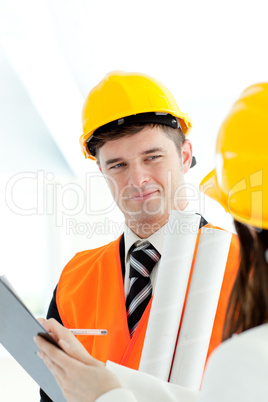 Handsome architect discussing with his colleague