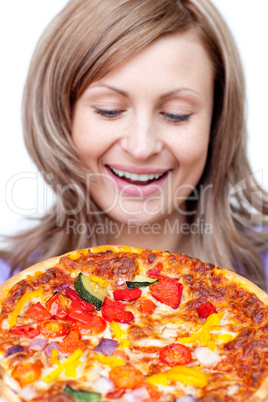 Radiant woman holding a pizza