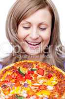 Radiant woman holding a pizza