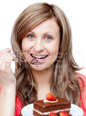 Charming woman eating a cake