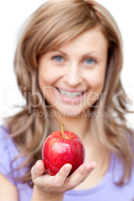 Attractive woman holding an apple