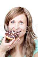 Happy woman eating a cake