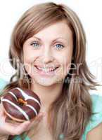 Delighted woman eating a cake