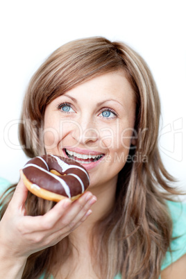 Hungry woman eating a cake