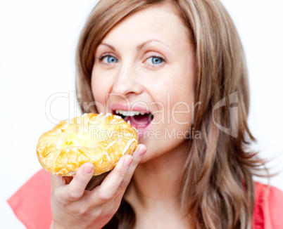 Attractive woman eating a cake