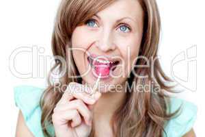 Radiant woman holding a lollipop