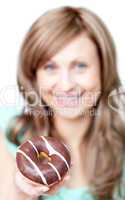 Smiling woman eating a cake