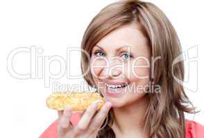 Bright woman eating a cake