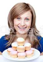 Confident woman eating a cake