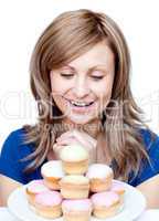 Cute woman eating a cake