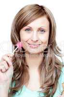 Serious woman holding a lollipop