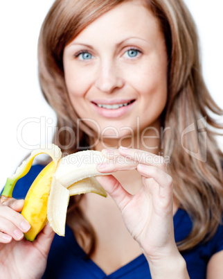 Radiant woman holding a bananna