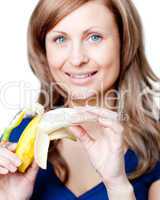 Radiant woman holding a bananna