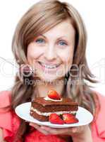 Cheerful woman eating a cake