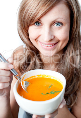 Positive woman holding a soup bowl