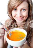 Positive woman holding a soup bowl