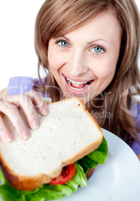 Beautiful woman holding a sandwich