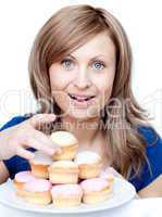 Pretty woman eating a cake
