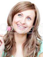 Delighted woman holding a lollipop